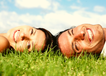couple laying on grass
